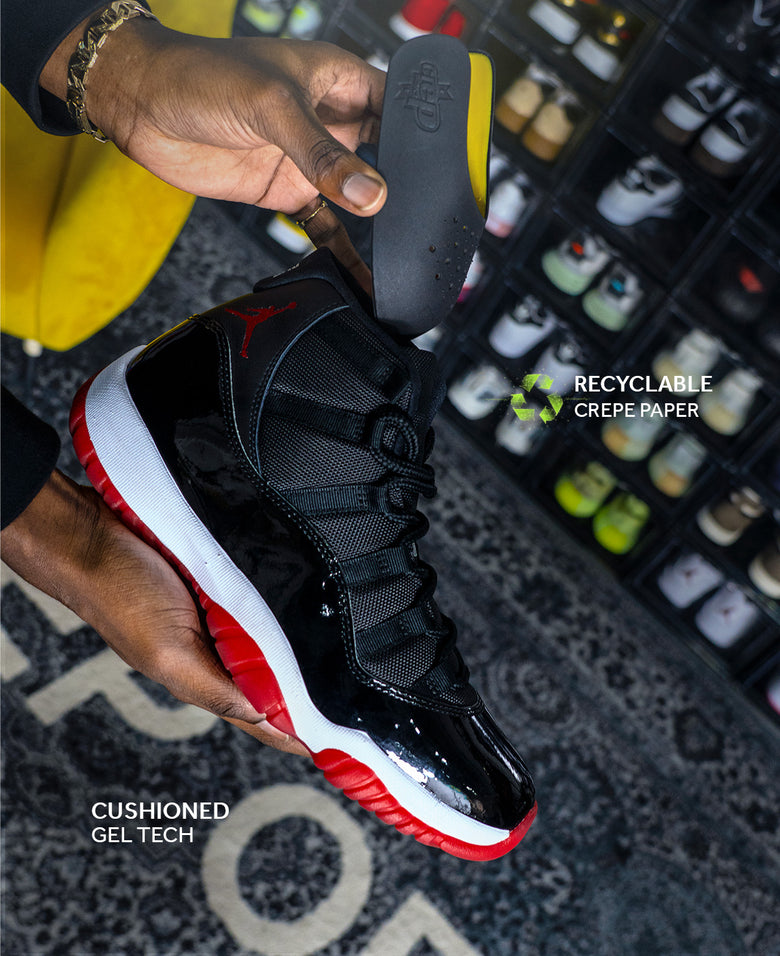 Man Demonstrating Crep Protect Sneaker Guard: Holding a Sneaker in One Hand.